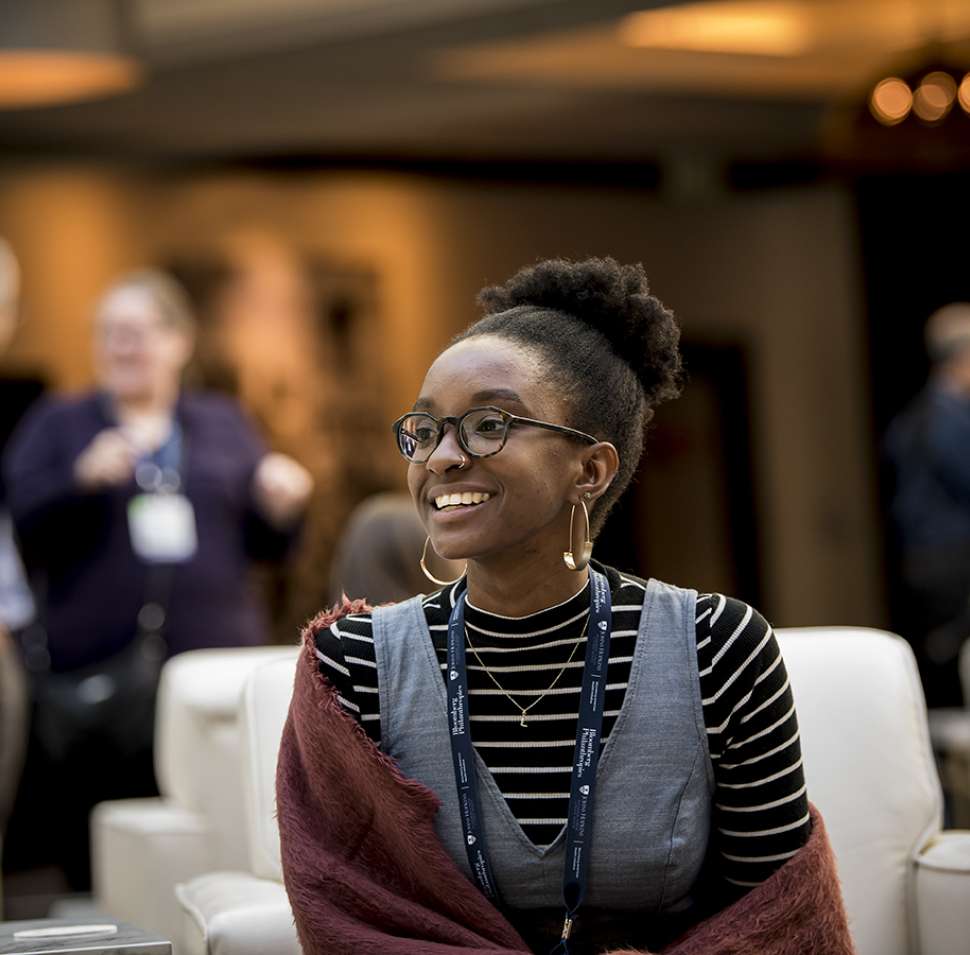 smiling young woman in conference room