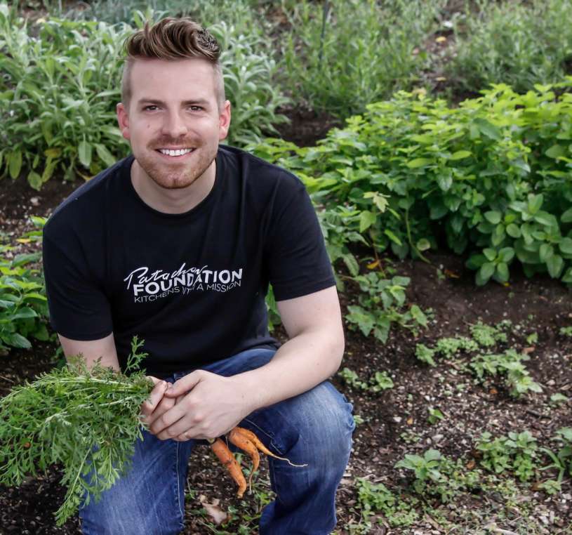 man smiling in garden